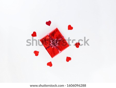 Box with a gift and hearts on a white background. Valentine's day concept.