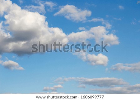 Bright blue sky with white clouds for background or wallpapers.The beauty of tropical nature for graphic design