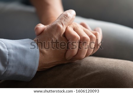 Close up of old couple arms, people hold hands enjoy dating two lonely souls met each other on sunset of their days. Being together at difficult life period such as disease or personal problem concept Royalty-Free Stock Photo #1606120093