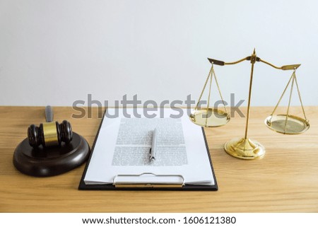 Scales of justice and Gavel on sounding block, object and law book to working with judge agreement in Courtroom, Justice and Law concept.