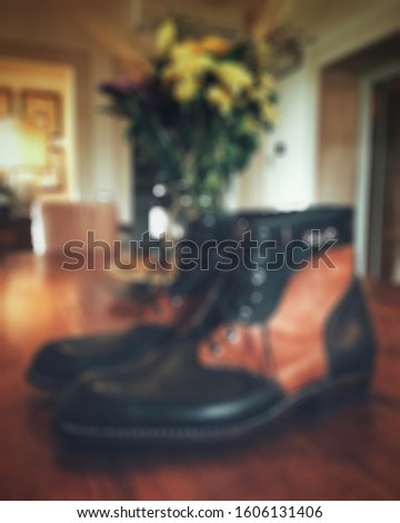 Blurry view of Mens old style leather boots.footwear concept