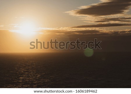 Beautiful sunrise over the sea, orange color filtered effect