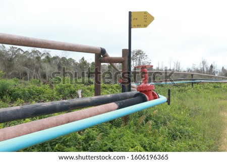 pipes stretched to channel petroleum from oil refineries to reservoirs