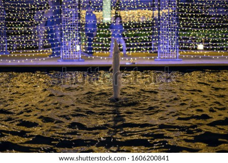 water fountain flowing with the led lights in the background.