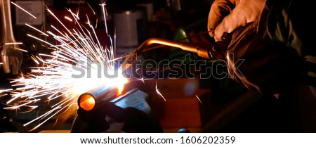 Welding using an oxyacetylene flame
autogeneous cutting metalwork welder sparks Royalty-Free Stock Photo #1606202359
