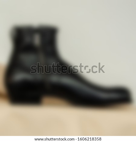 Blurry view of Mens old style leather boots.footwear concept