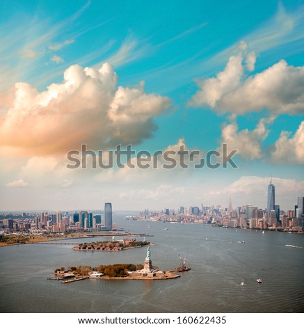 Beautiful sky over New York. Statue of Liberty, Manhattan and Jersey City.