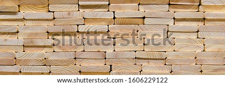 Wood texture.Stack of wood planks on lumber yard. lumber industrial wood texture timber. Royalty-Free Stock Photo #1606229122