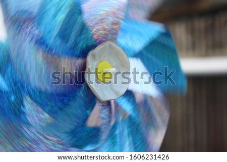 Blue and silver pinwheel at movement