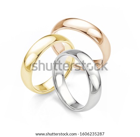Three Wedding Rings in White Gold Yellow Gold and Rose Gold Wedding Rings Isolated on White Background