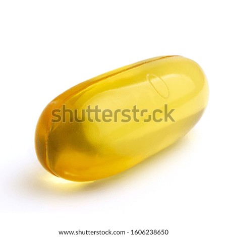 Omega 3 supplement, fish oil yellow capsules isolated on white background, macro image.