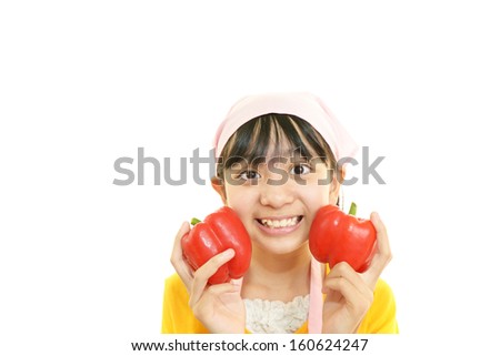 Smiling girl with vegetables