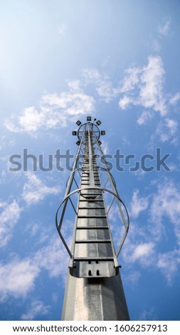 Telecommunication tower with antenna and lamps on top