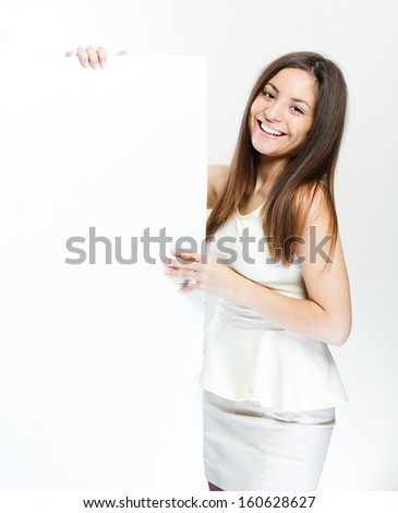 beautiful happy smiling woman hold white blank board 