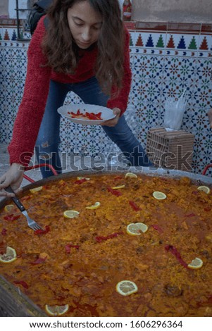 Big paella of chicken home made , tomato, rice, saffron