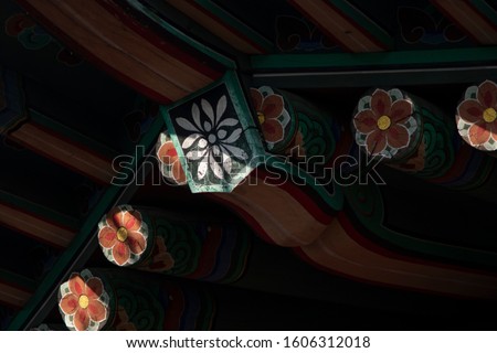 A pattern of Korean. Korean traditional multicolored paintwork on wooden buildings. Korean traditional colorful paintings. (dancheong)