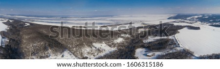 Top View of the fields ,  forests  and the Kyiv Sea in snow , winter time, Ukraine , - drone photo