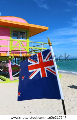 Beautiful National Flag of New Zealand on Tropical Beach