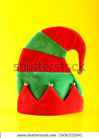 Christmas elf hat isolated on yellow background