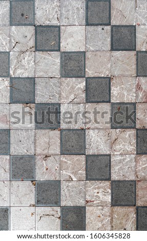 Wide geometric checkered floor with marble tiles 