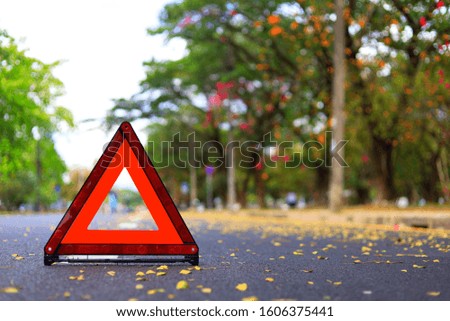 Red triangle, red emergency stop sign, red emergency symbol on road. With copy space for text or design