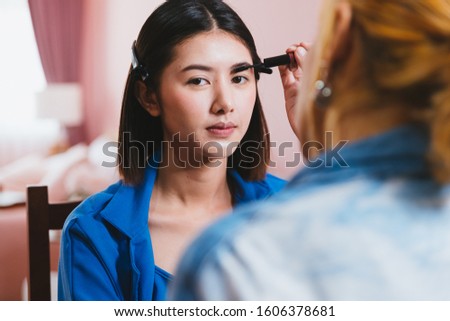 Beautiful young asian woman and professional makeup artists applies eye shadow. Beautiful woman face. Perfect makeup, Natural make up, Facial treatment, Perfect skin