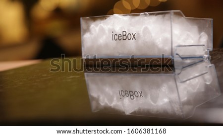 ice box written in plastic icebox. black marble floor. ice box of the refrigerator.