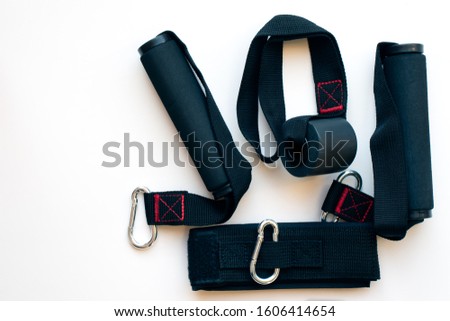 top down view of assorted accessories for resistance tubes isolated on a white background