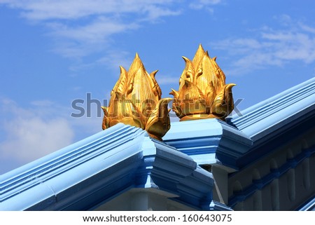 Golden lotus  statue  on  banister in  Thai temple  