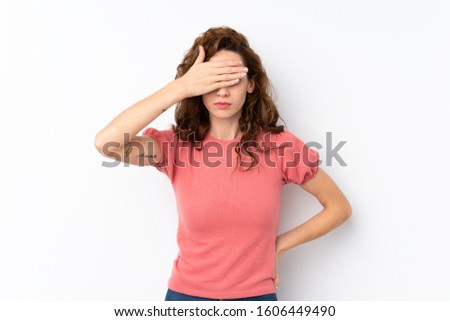 Young pretty woman over isolated background covering eyes by hands. Do not want to see something