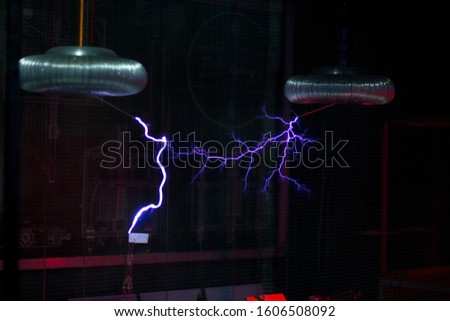 Artificial lightning from Tesla coils over the layout of the city