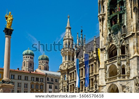 The Marienplatz in Munich, Germany, with the Neues Rathaus and glockenspiel, the Virgin and Child, and the towers of the Frauenkirche in the background.