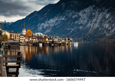 Hallstatter lake and Hallstatt village with blue sky in Austrian Alps / Evening light during autumn season / One of most popular tourist location in Austria