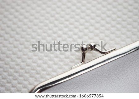 Purse for coins. Wallet for change. Closed leather purse closeup on a white background