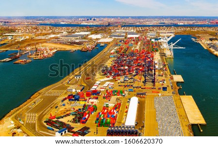 Aerial view of Dry Dock and Repair and Port Newark and Global international shipping containers, Bayonne, New Jersey. NJ, USA. Harbor cargo. Staten Island with St George Ferry terminal. Mixed media.