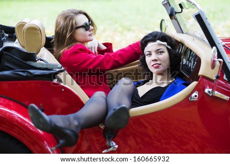 Young women take vocation ride on red car
