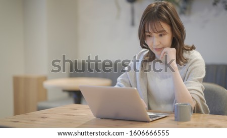 Woman working in a cafe Royalty-Free Stock Photo #1606666555