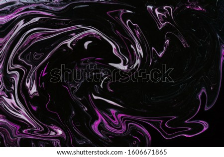 Colorful marbleized painting background. Liquid marbling paint background. Fluid painting abstract texture. Intensive colorful mix of acrylic vibrant colors. Style incorporates the swirls of marble