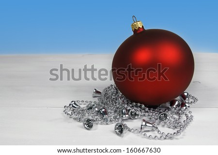 christmas decoration with red bauble and silver chain