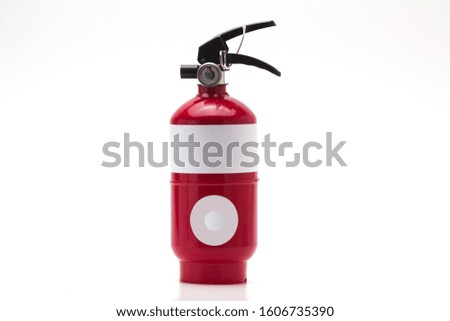 Red fire extinguisher with copy space 
on white background