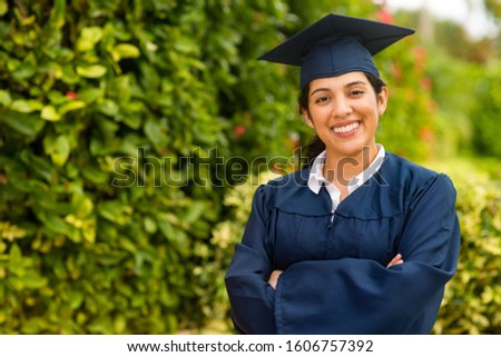 Hispanic student on graduation day. Royalty-Free Stock Photo #1606757392