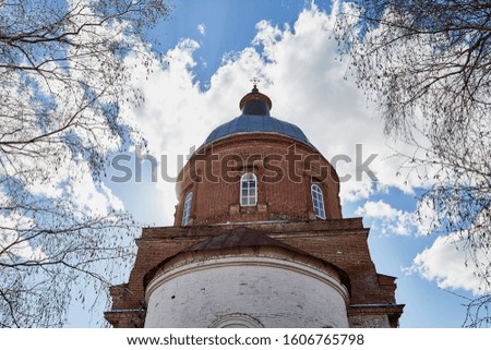 Traditional old russian church with domes in nature landscape in a nice day and sky with clouds background. Architecture in the Orthodox religion