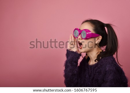 Surprised asian woman, Shouting girl wearing funny glasses on isolated pink background, Wow face feelings with copy space for advertising.