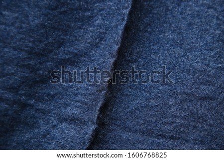 Denim fabric background image.  This material is used to make jeans. 
