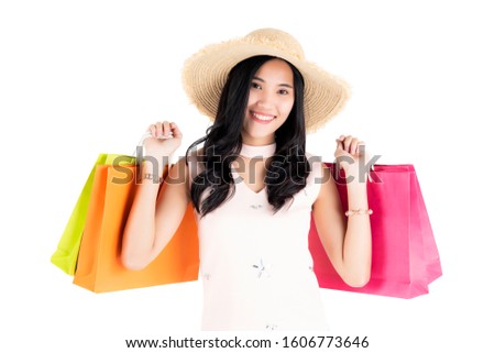 Asian women carrying high quality shopping bags
While enjoying the splendor on a white background, the concept of shopping for business marketing