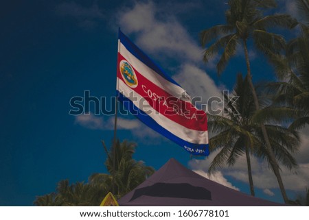 Costa Rica flag in the blue sky