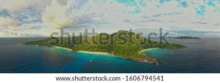 Landscape Seychelles Island La Digue in Indian ocean, beautiful blue sea with waves, sand beaches and green forest in the tropical paradise. Travel pictures.