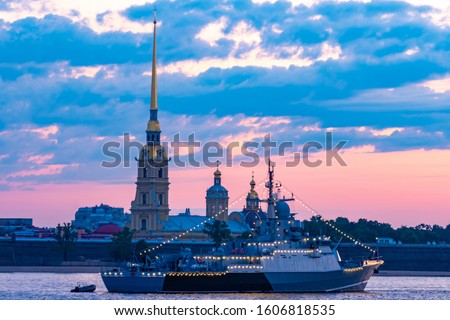 Saint Petersburg. Russia. Warship with garlands in the waters of the Neva. Ship on the background of the Peter and Paul fortress. White nights in Petersburg. Festive St. Petersburg. Cities of Russia Royalty-Free Stock Photo #1606818535