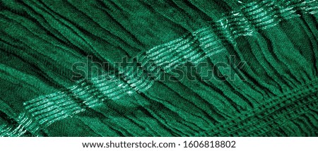 The texture of the background picture the color of the fabric under water, green-blue corrugated fabric, fabric with parallel or diagonal folds with serrated folds; products from such a fabric.