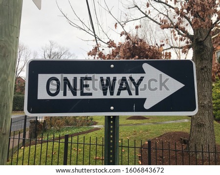One way street sign black and white with arrow